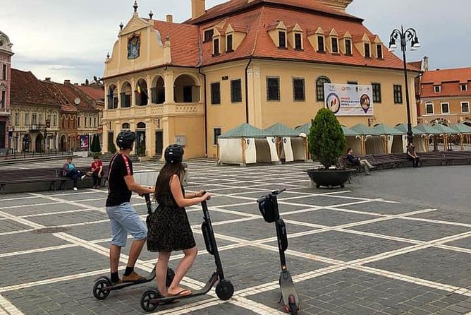 Brasov Old Town Guided Tour With Electric Scooters - Guide quality and group atmosphere