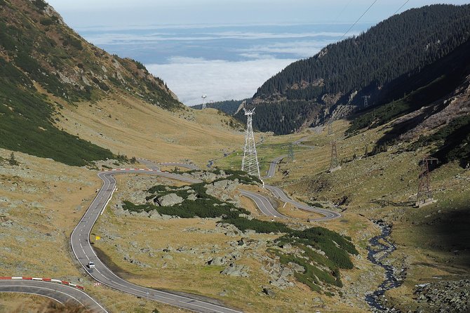 Brasov Private Tour: Transfagarasan road & Poienari Fortress - Vidraru Dam and the long descent