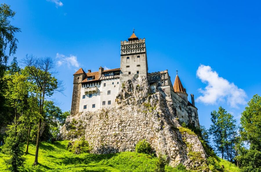 Bucharest: Dracula Castle, Peles Castle & Brasov Guided Tour - Bran Castle and the Dracula question