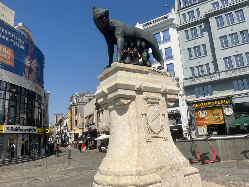 Bucharest: Walking tour with Italian speaking guide for small groups - Starting beneath Caru’ cu Bere’s famous sign