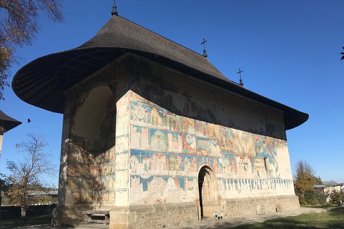 Bucovina Extra Day Monasteries Tour - Dragomirna: height, narrow lines, and a forest setting