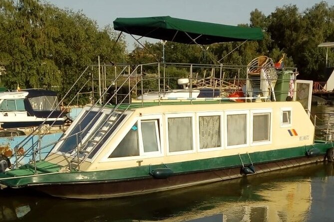 <strong><em>Daily Tour in the Danube Delta Departing from Tulcea Port</em></strong> – Leaving Tulcea Port for the Danube Delta’ /></p>
<p><p>Tulcea is the natural starting point for exploring the Danube Delta. The city sits where the river begins to spread into its many channels, lakes, reed beds, and marshes before reaching the Black Sea. From the port, you move quickly from an urban waterfront into a much quieter world of water and open sky.</p>
</p>
<p><p>This experience is built around one main stop: the Danube Delta itself. That sounds simple, but it is the right focus. A short boat excursion is not trying to cover every corner of the delta. Instead, it gives you several hours to see the waterways, watch for birds, and understand how much of the region is best reached by boat.</p>
</p>
<p><p>I like the fact that the tour is designed as a private group booking, yet the boat activity itself has a maximum of 10 passengers. That number matters. You are not likely to be packed onto a large sightseeing vessel, and a guide can explain the route without shouting across a crowded deck.</p>
</p>
<p><p>The exact boat style may vary by operating conditions, but one detailed account describes a modern speedboat with comfortable seating. A speedboat makes the outing more exciting and lets you cover more water in four hours. The tradeoff is that it may feel less quiet than a slow traditional boat, especially if you are hoping for a long, silent wildlife watch.</p>
</p>
<h2 id="what-the-four-hour-route-gives-you">What the Four-Hour Route Gives You</h2>
<p><img width="669" height="446" decoding="async" src=