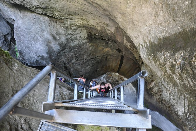 Small-Group Day Trip to the Epic 7 Ladders Canyon from Brasov - Climbing beside the waterfalls