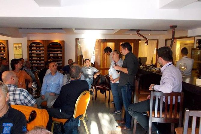 Traditions in Bucharest: Village Museum and Wine Tasting Tour - Romanian wine and a plate of local tastes